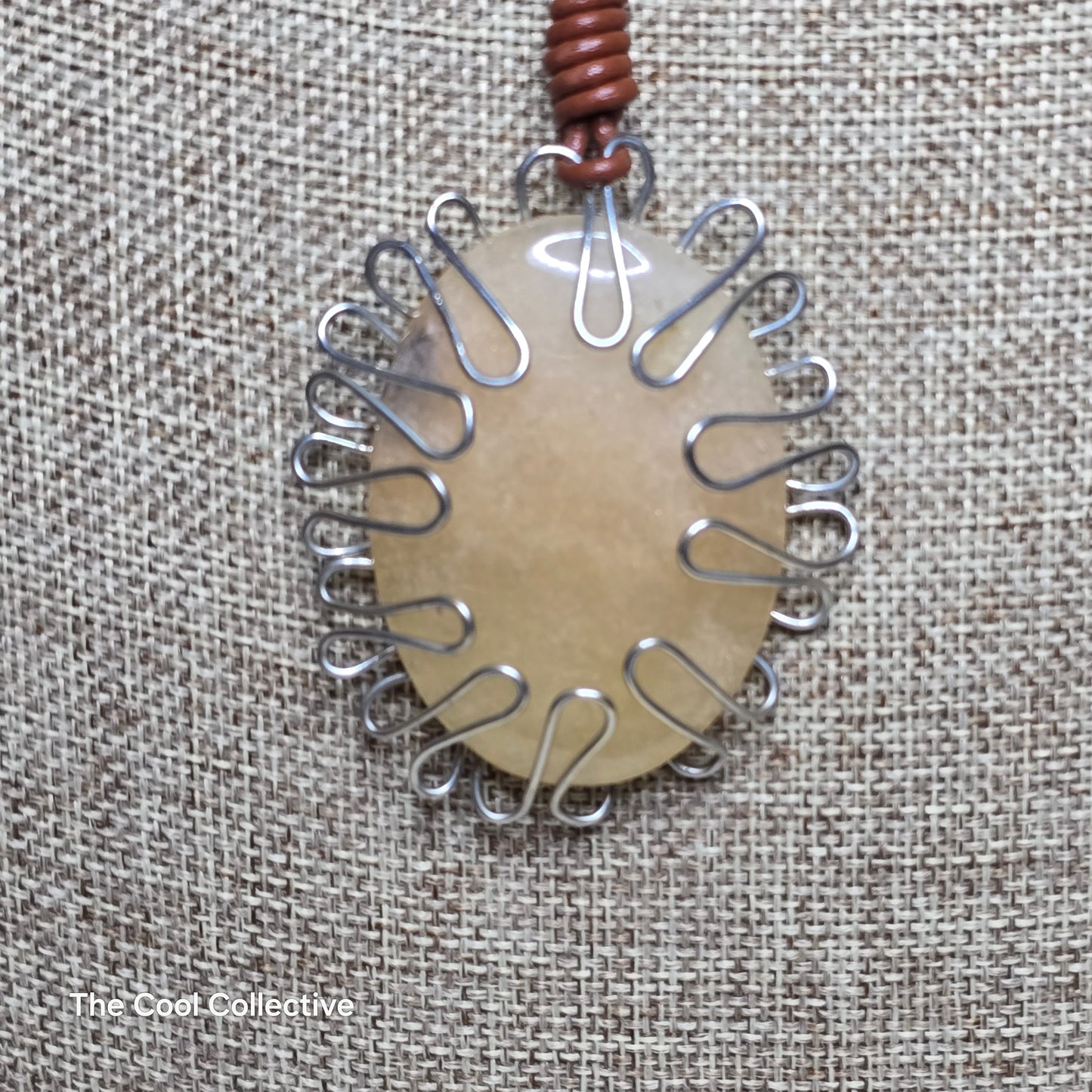 Handmade Jewelry; Wire-Wrapped Peach Color Gemstone; Medium Brown Leather; Adjustable Necklace Tina Lucas; The Cool Collective; Woman-Owned Small Business