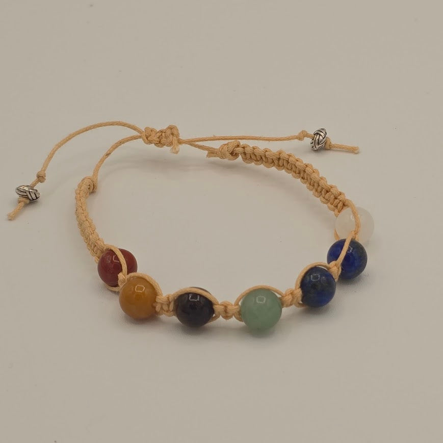 Handmade Jewelry; Chakra Bracelets; Cream Cotton Cord; Adjustable Style; Silver Tone Accents; Tina Lucas; The Cool Collective; Woman-Owned Small Business