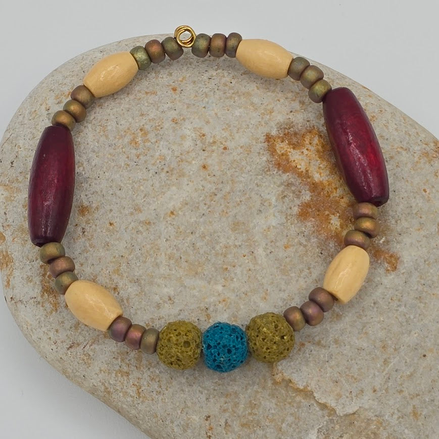 Handmade Jewelry; Memory Wire Bracelet with Glass, Wood, and Lava Beads; Tina Lucas; The Cool Collective; Woman-Owned Small Business