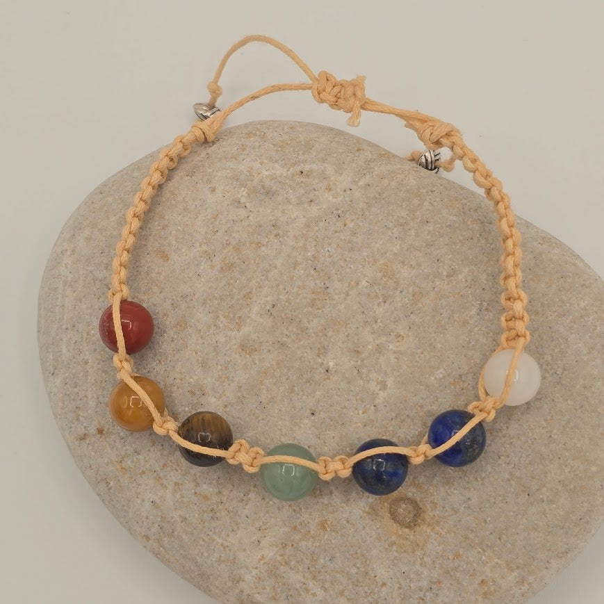 Handmade Jewelry; Chakra Bracelets; Cream Cotton Cord; Adjustable Style; Silver Tone Accents; Tina Lucas; The Cool Collective; Woman-Owned Small Business