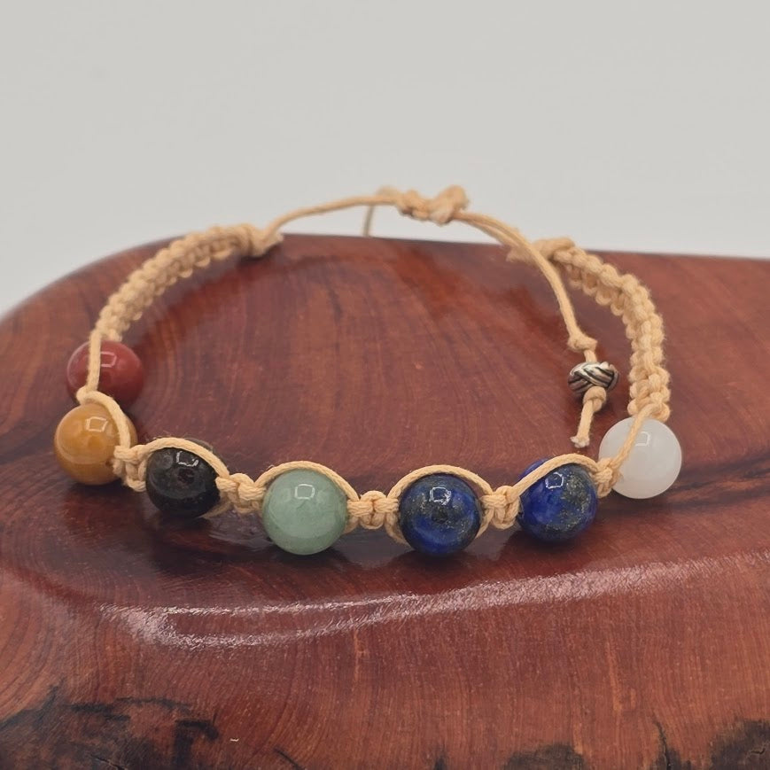 Handmade Jewelry; Chakra Bracelets; Cream Cotton Cord; Adjustable Style; Silver Tone Accents; Tina Lucas; The Cool Collective; Woman-Owned Small Business