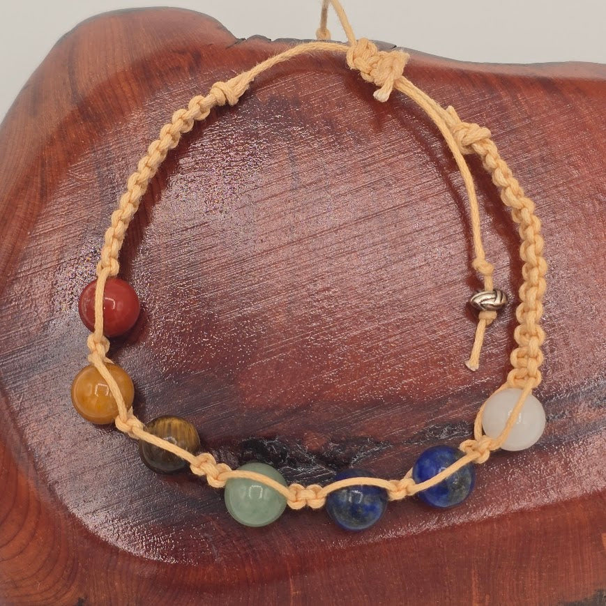 Handmade Jewelry; Chakra Bracelets; Cream Cotton Cord; Adjustable Style; Silver Tone Accents; Tina Lucas; The Cool Collective; Woman-Owned Small Business