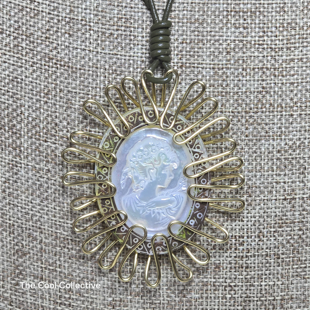 Handmade Jewelry; Mother of Pearl Cameo; Gold Tone Wire Wrapping; Olive Green Leather; Adjustable Necklace; Tina Lucas; The Cool Collective; Woman-Owned Small Business