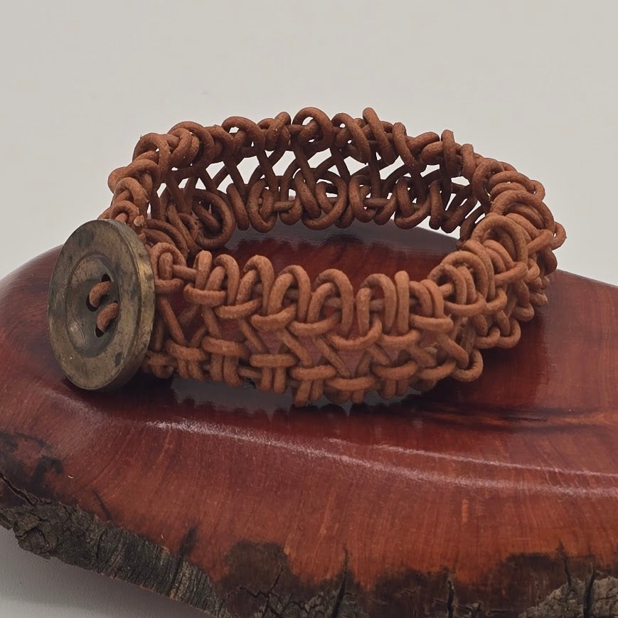 Handmade Jewelry;  Woven Natural Tan Leather and Large Decorative Button Tina Lucas; The Cool Collective; Woman-Owned Small Business