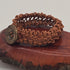Handmade Jewelry;  Woven Natural Tan Leather and Large Decorative Button Tina Lucas; The Cool Collective; Woman-Owned Small Business