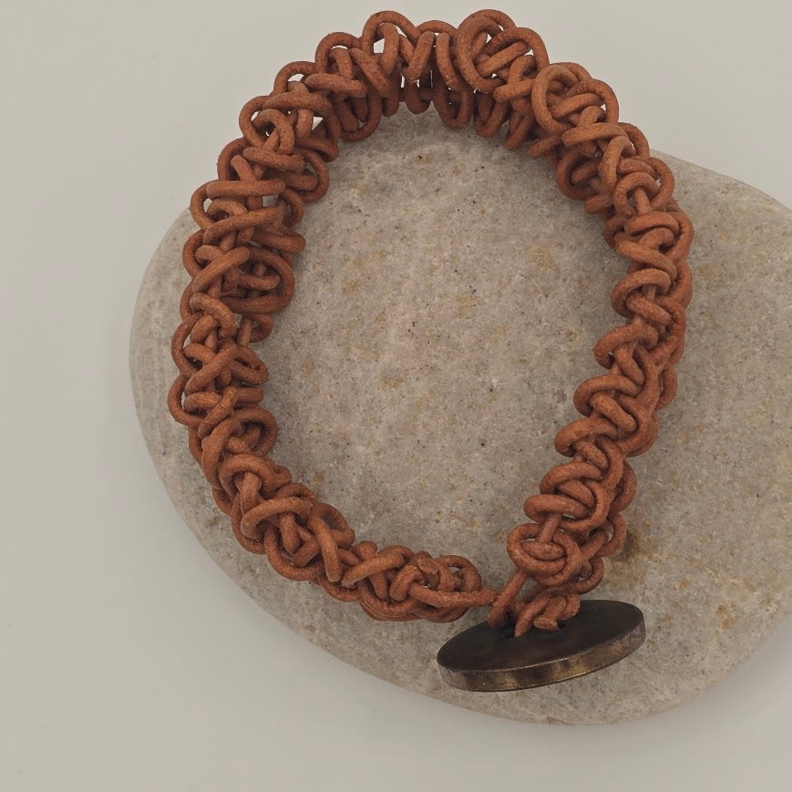 Handmade Jewelry;  Woven Natural Tan Leather and Large Decorative Button Tina Lucas; The Cool Collective; Woman-Owned Small Business